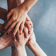 collaboration risks being personified by a bunch of hands grabbing each other